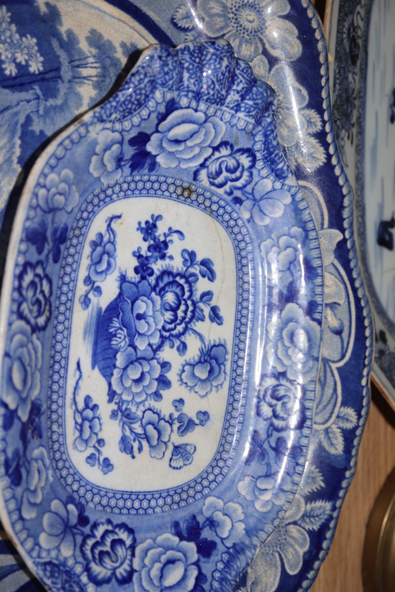 An 18th century Chinese blue and white octagonal dish and three Staffordshire pottery dishes, length 44cm